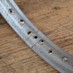 Felge 1.50 -19 silberfarben mit Patina, Breite 55 mm, Bohrungsdurchmesser 6 mm, 36 Loch 